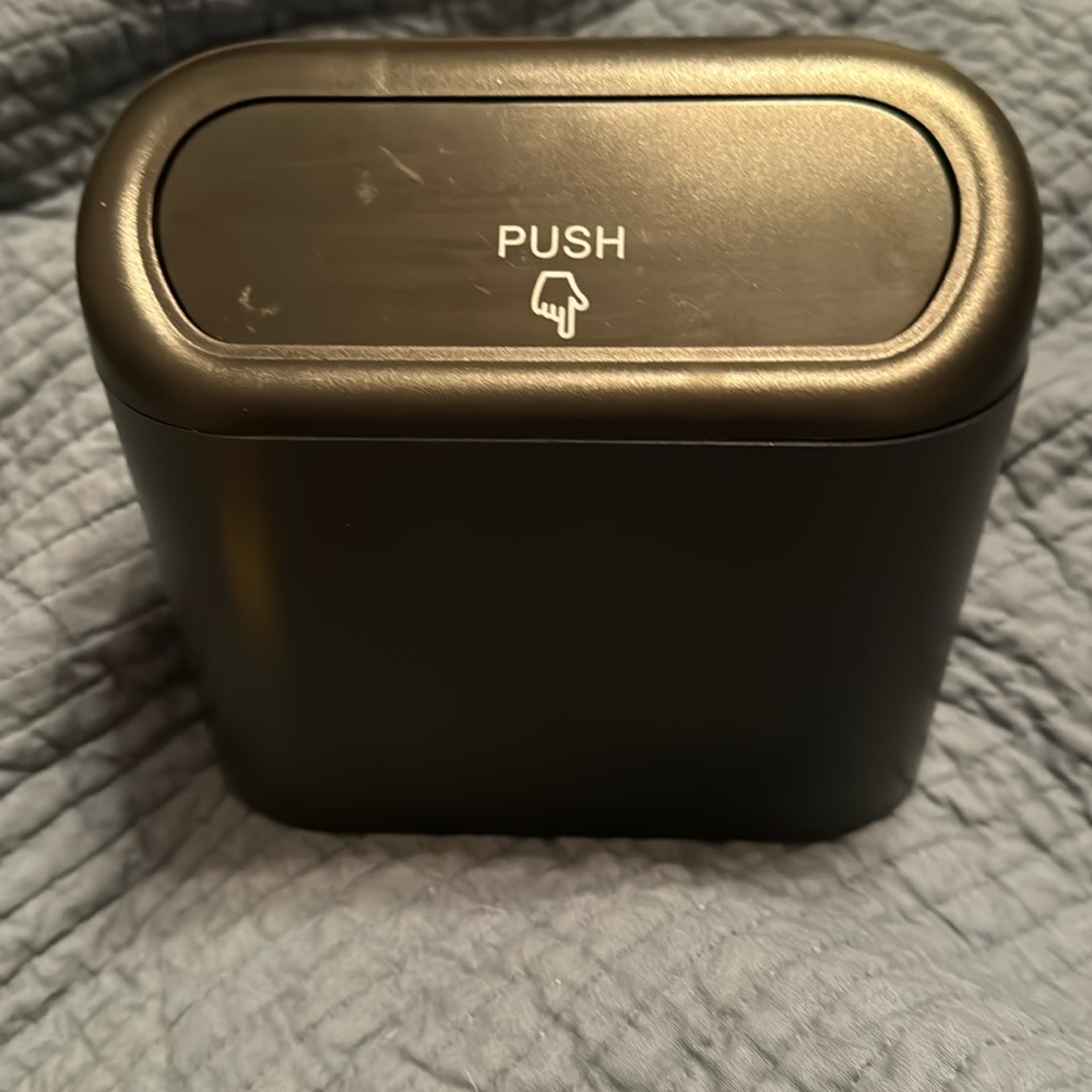 Small black trash container with clip and bags